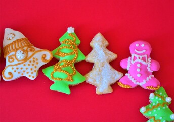 Christmas composition: Christmas cookies on red background