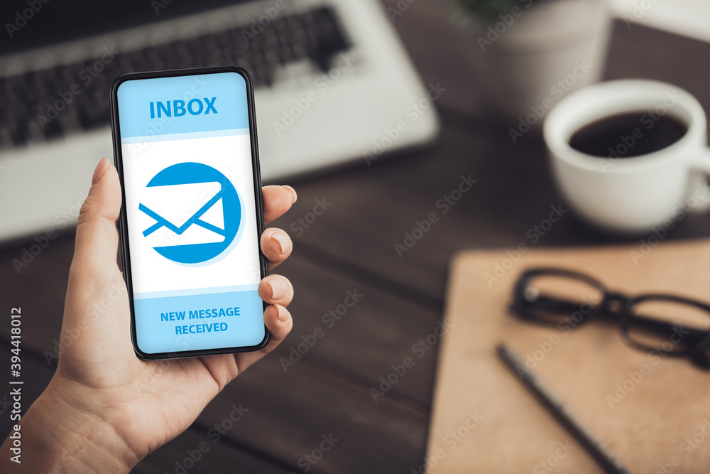 Poster Collage with female hand showing cellphone with mail envelope and new message notification on screen, copy space