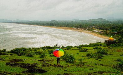 View from hilltop, person on the beach, house on the beach, beach view, beach side property,...