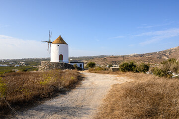 Fototapeta na wymiar Old windmill in Emporio village on the south side of Santorni. Cyclades Islands, Greece