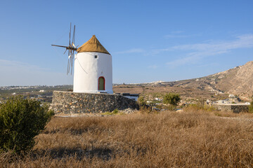 Old windmill in Emporio village on the south side of Santorni. Cyclades Islands, Greece