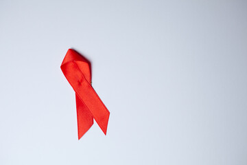 Aids Awareness Red Ribbon With Copy Space. Flat lay
