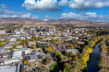 The Boise River flows beside the skyline of the city bearing its name