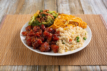 A view of a 2 item combo Chinese fast food combo, in a restaurant or kitchen setting.