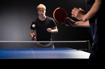 Portrait of young man playing tennis