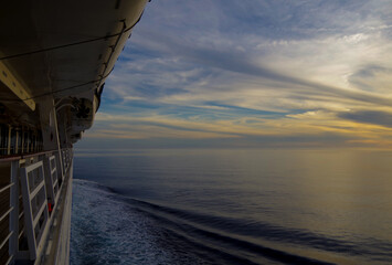 Dream holiday or vacation on luxury cruiseship or cruise ship liner at sea with sunset, sunrise or...