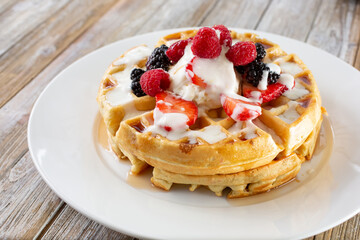 A view of a plate of berry waffles.