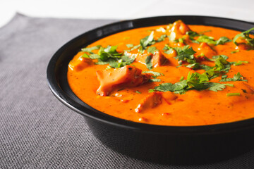 A view of a bowl of butter chicken.