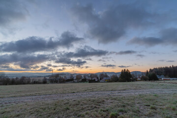 Rybnik village with pasture land in frosty color morning before sunrise