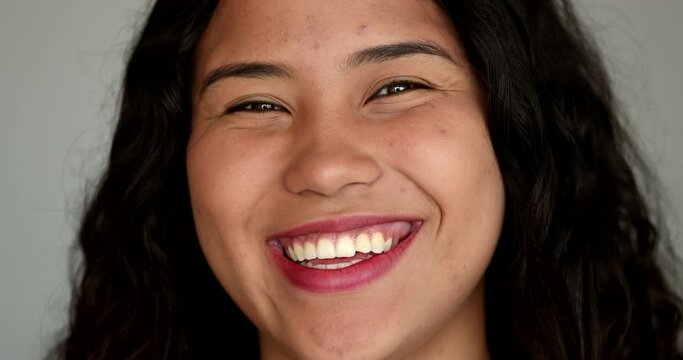 Happy hispanic girl smiling. Teen latina young woman smile. Real people series