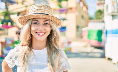 Young caucasian tourist girl smiling happy walking at fairground.