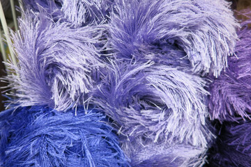 Obraz premium Purple threads for knitting with different shades with a long force