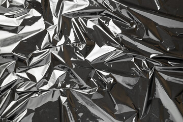 Smooth texture. Black shiny film bag pattern. Wrap transparent dark cellophane background. Real...