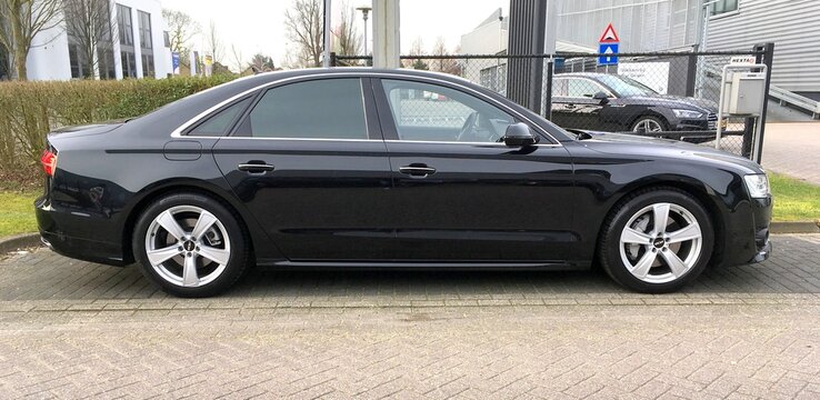 Naarden, The Netherlands - March 11, 2017 Black Audi A8 parked by the side of the road. Nobody in the vehicle.