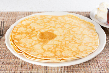 A view of a plate of Swedish pancakes.