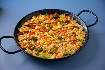 Traditional spanish paella with vegetables and chicken.
