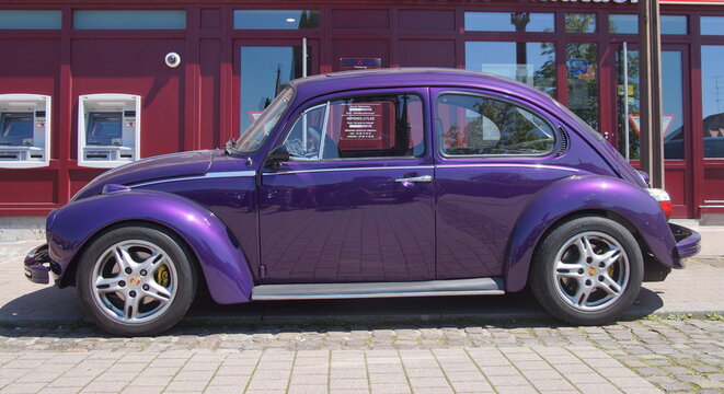 Phalsbourg, Alsace, France - May 5, 2016: Purple Beetle parked on the side of the street in the city of Phalsbourg.