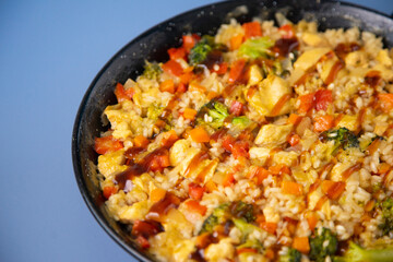 Traditional spanish paella with vegetables and chicken.