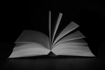 open book on black background