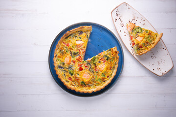 Traditional salmon quiche with broccoli and vegetables