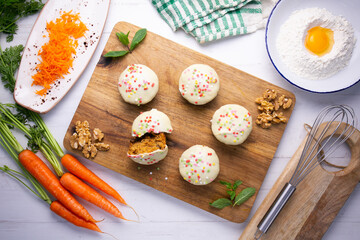 Mini carrot cake with white chocolate cover and sprinkles