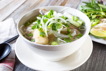 A view of a bowl of chicken pho.