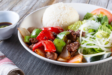 A view of a plate of shaking beef.