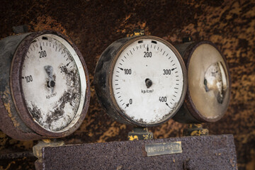 broken gauges on an old machine