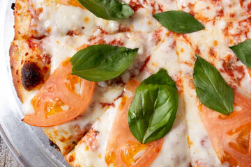 A closeup view of a Margherita pizza.