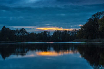 Fototapeta na wymiar sunset over a rural lake