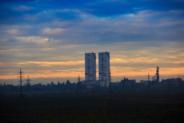 Ore or coal mine twin towers at dawn or dusk