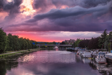 Colorful sunset near Reims city canal in summer, France - 394437058