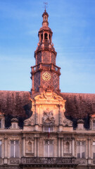 Fototapeta na wymiar Reims central city hall tower with a clock, Champagne region, France