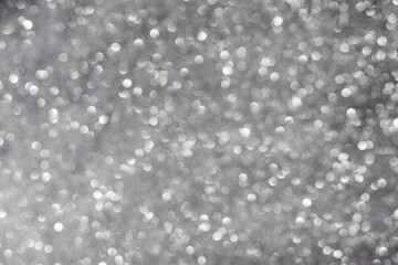 Christmas bokeh effect. Abstract texture of silvery color.