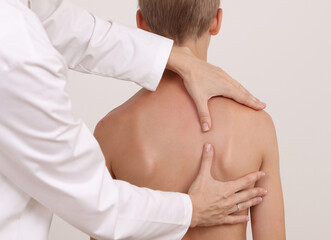 Physiotherapist exam for teenage boy. Manual Muscles Tests and Posture Checking . Preventive Health...