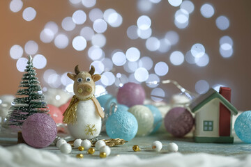 Composition from New Year's toys. Christmas tree. Bokeh. Year of the bull.