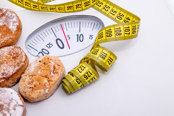 scale with tape measure and cookies or polvorones