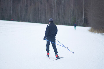 Fototapeta na wymiar Cross country Skilling. A skier goes skiing on the ski track.