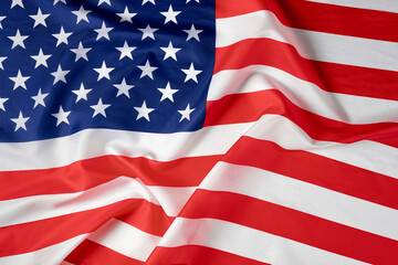 Obraz premium Close up of ruffled American flag. Satin texture curved flag of USA. Memorial Day or 4th of July. Banner, freedom concept
