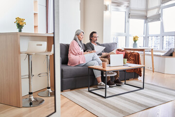 Fototapeta premium Couple looking at the papers
