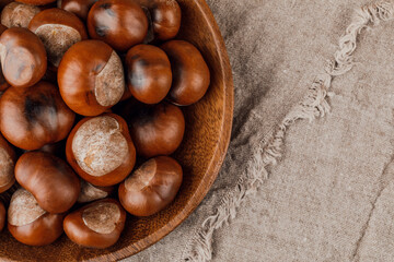 Chestnuts on an old wooden table