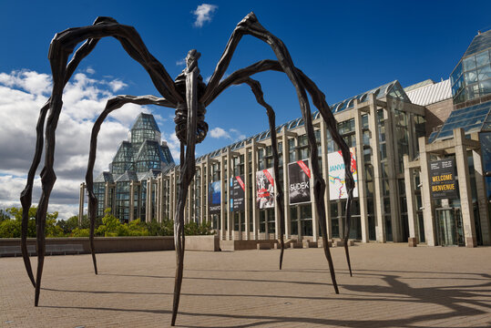 Entrance to the National Gallery of Canada in Ottawa with bronze sculpture art of giant spider called Maman Ottawa, Canada - September 23, 2016