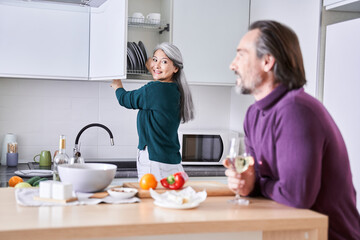 Woman serves the table for the dinner