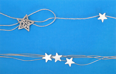 Traditional christmas blue background with silver ribbons and stars for greeting lettering / announcement