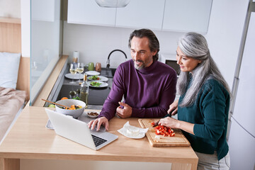 Couple prepares their favorite recipe