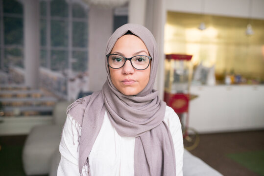 Young woman looking at camera in office, Sweden