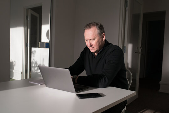 Mature man working ion office, Sweden