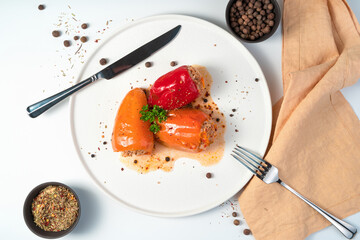 Vegetable-meat dish with spices on a light background. Bell pepper with meat. The concept of cooking.