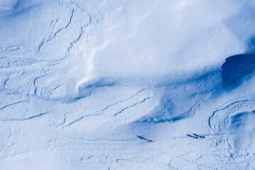 Fototapeta na wymiar Drone image of mountains in winter. Image with snow, texture and shadows. 