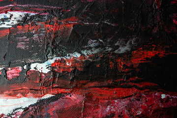 abstract paint background. white,black, and red acrylic paint on canvas. textured abstract multi-color background-close-up